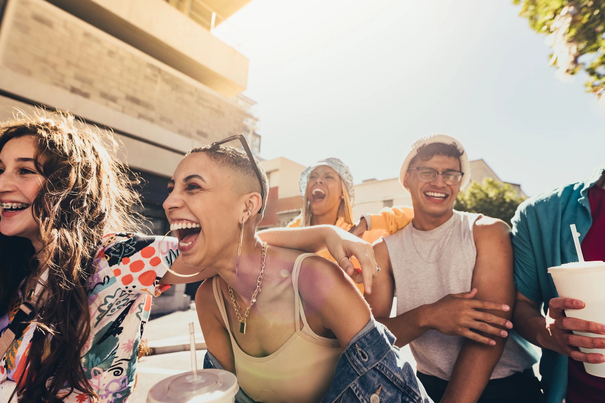 Group of young friends laughing together outdoors