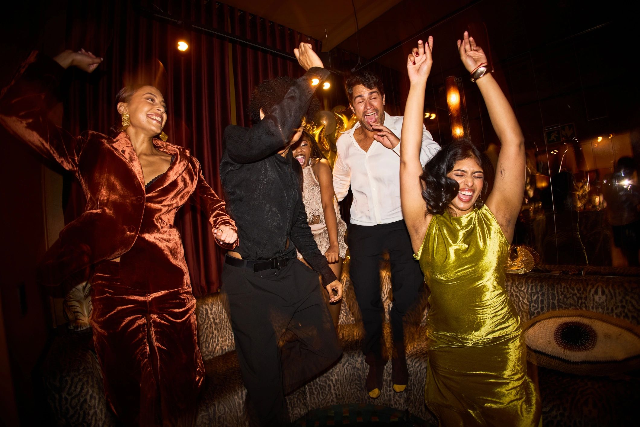 Joyful young friends celebrating together